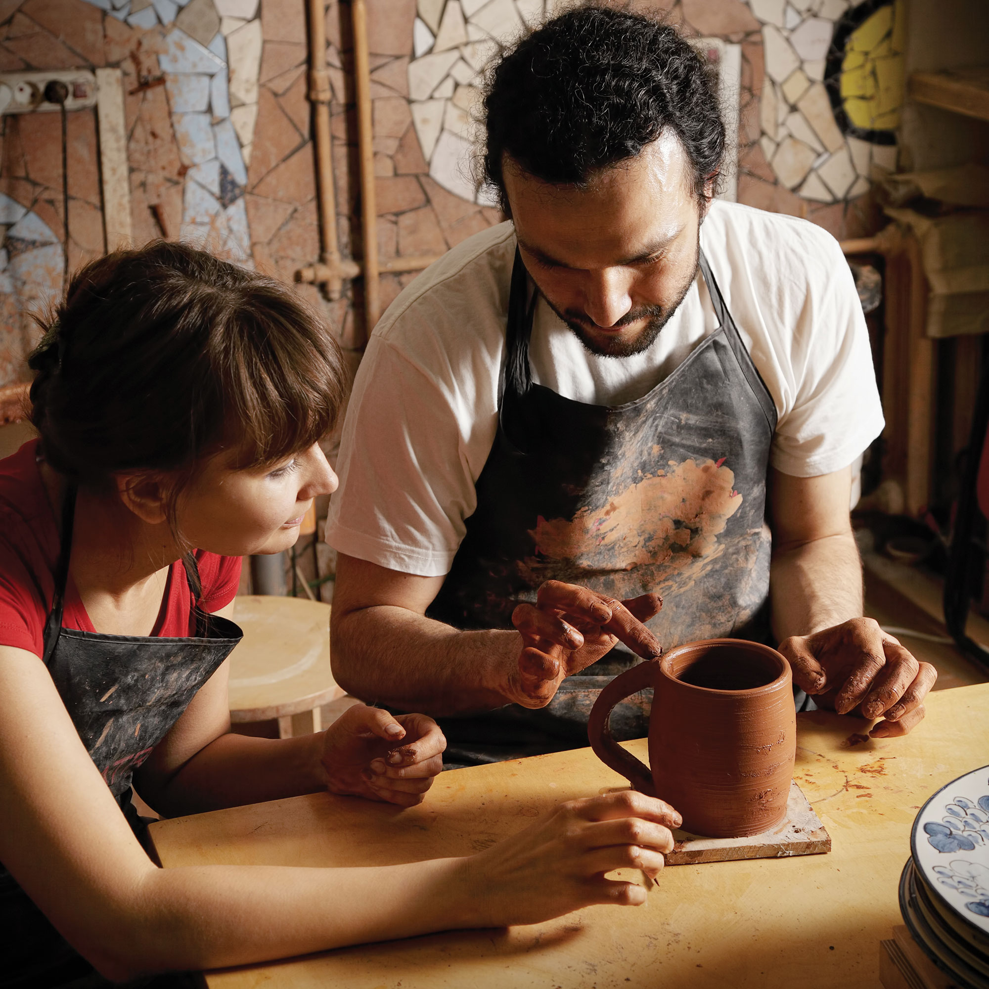 pottery class instructor student