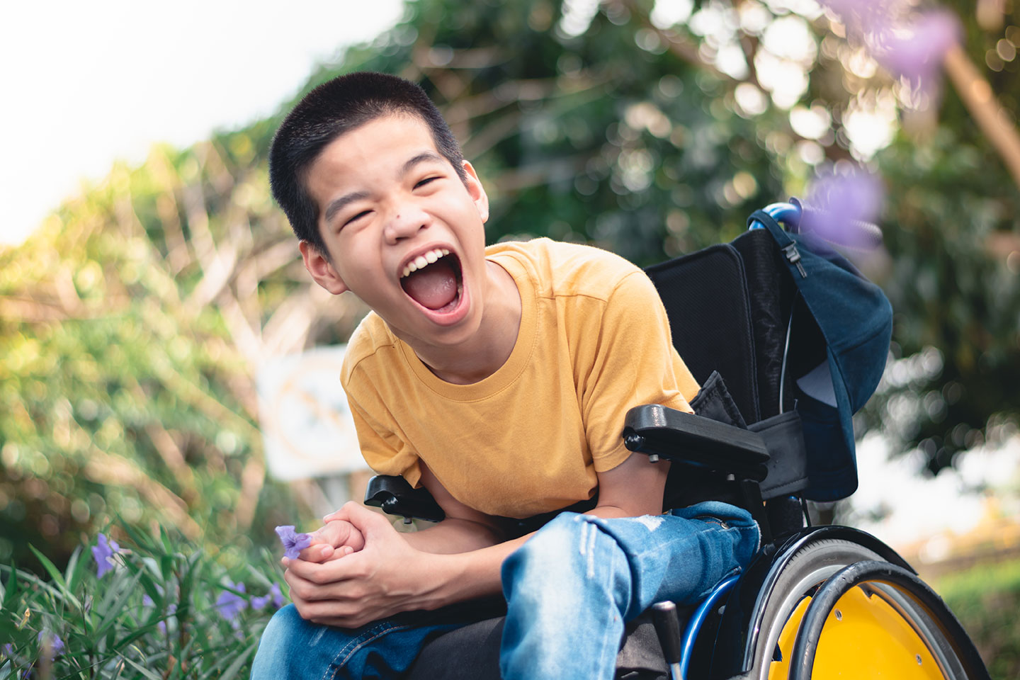 excited boy in wheelchair